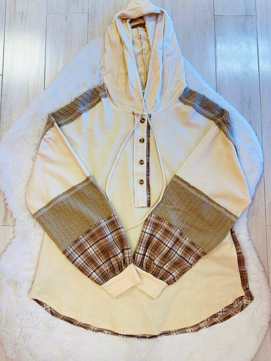 Women’s cream hooded top with plaid sleeves