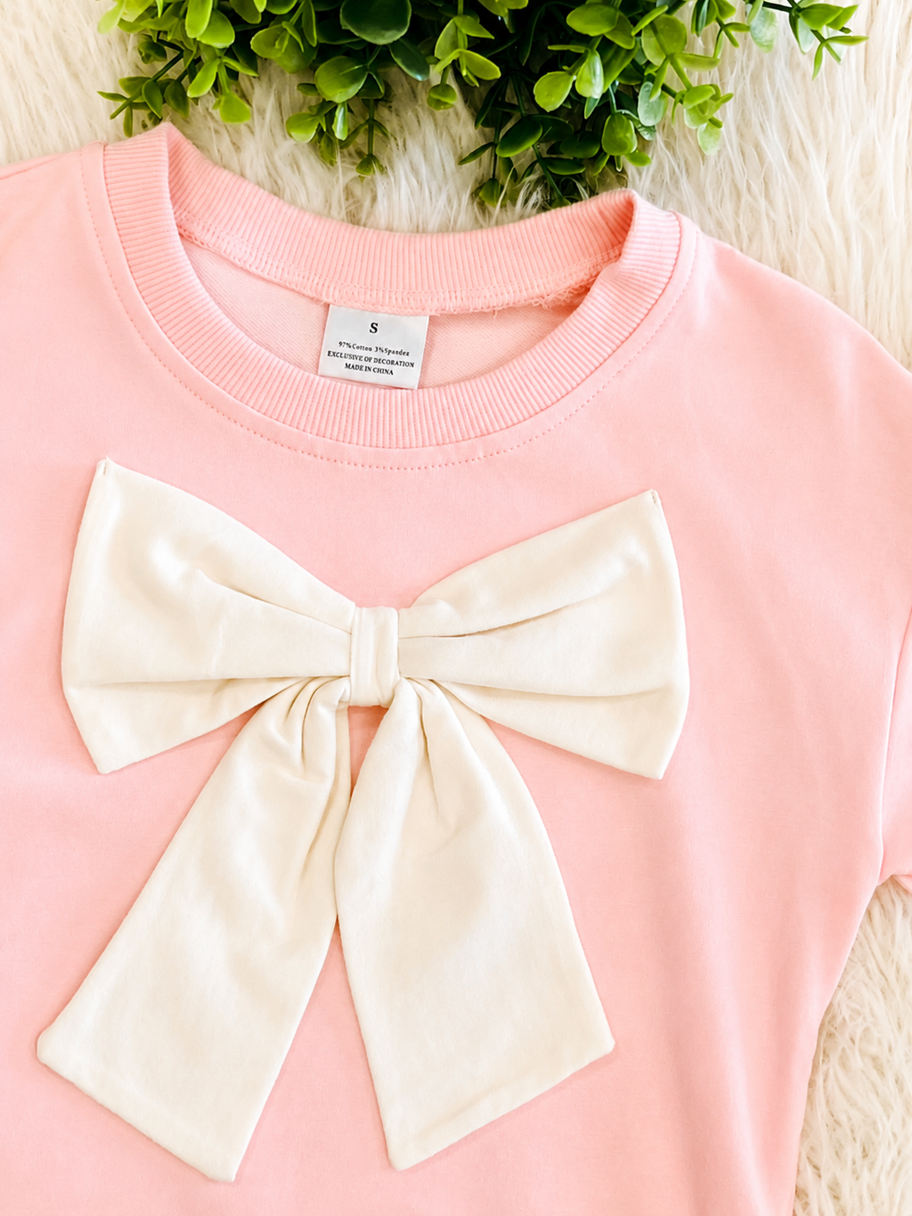 Girl’s Light Pink Outfit with Bow on Sweater