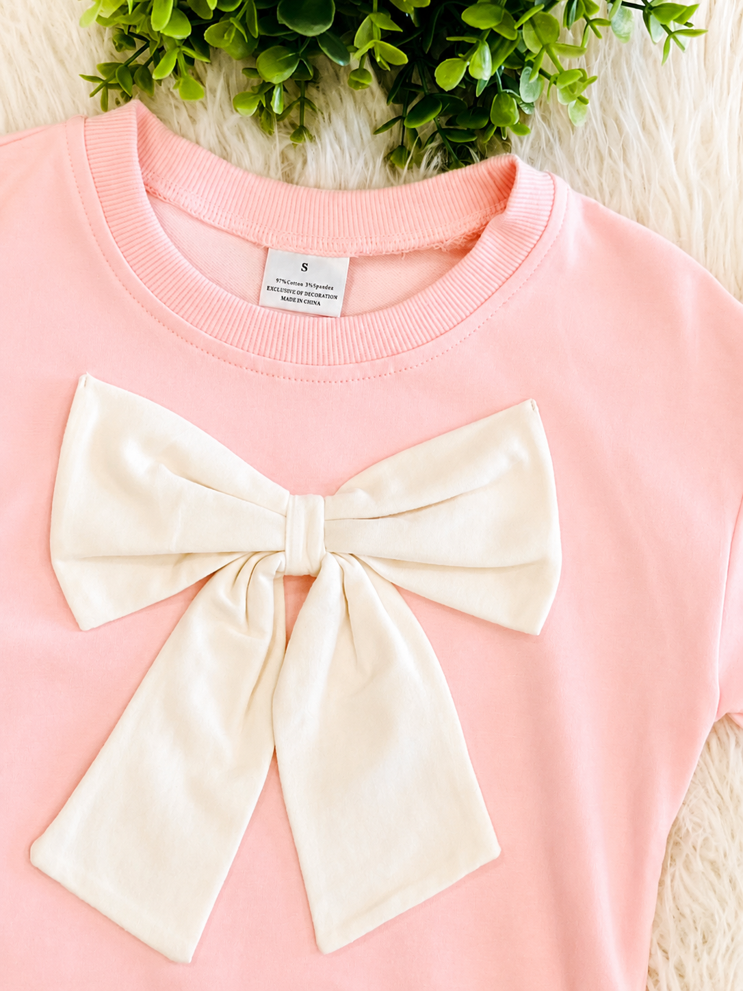 Girl’s Light Pink Outfit with Bow on Sweater