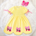 Girl’s yellow and pink crayon with pink ribbons on sleeve dress