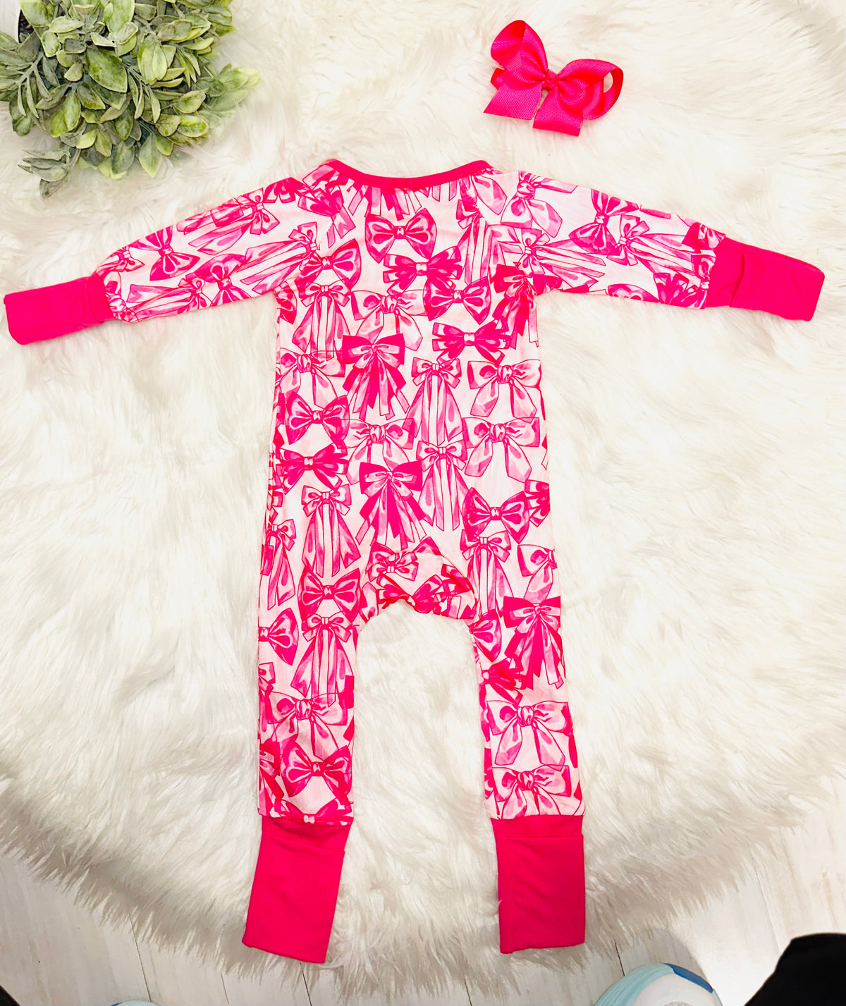 Girl’s dark pink bow sleeper