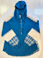 Women’s blue hooded top with plaid sleeves