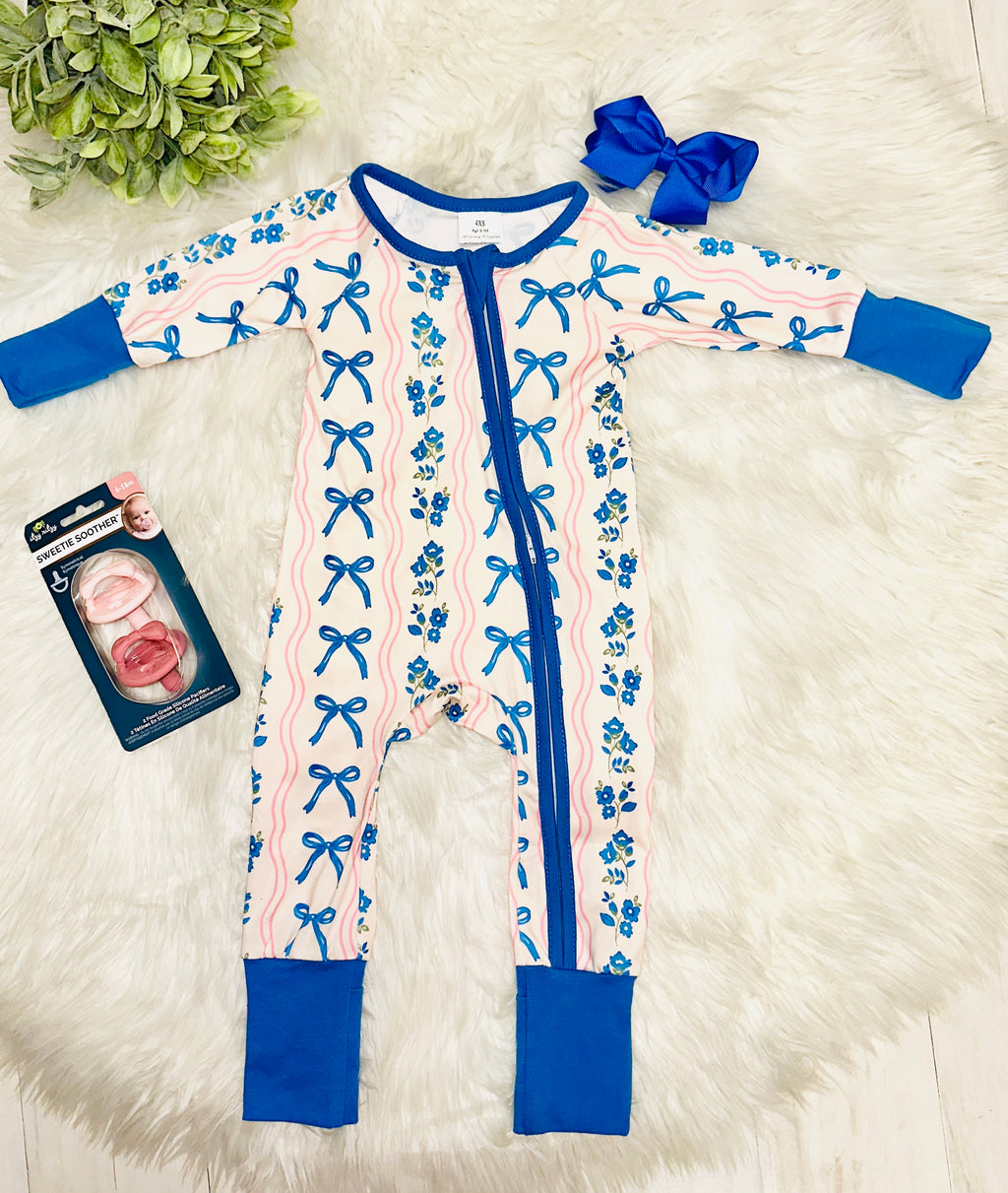 Girl’s pink and blue bow and floral sleeper
