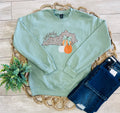 Women’s Sage Green Crewneck Features a cute Leopard - Print outline of Kentucky paired with stacked Autumn Pumpkins