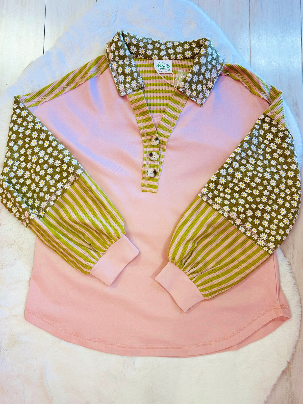 Women’s pink and green floral collared top