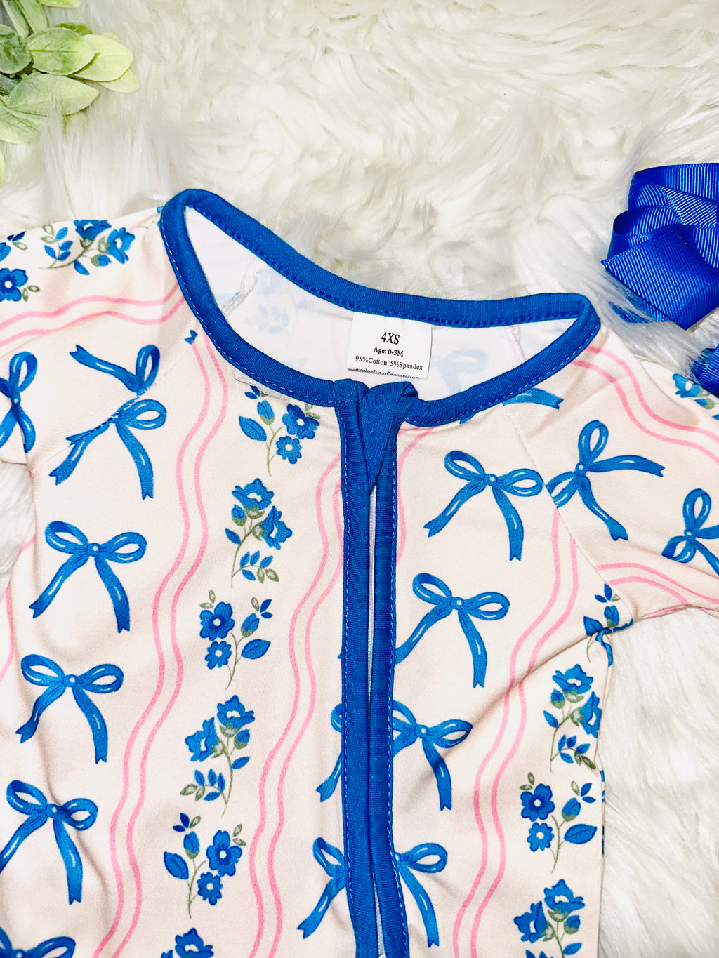 Girl’s pink and blue bow and floral sleeper