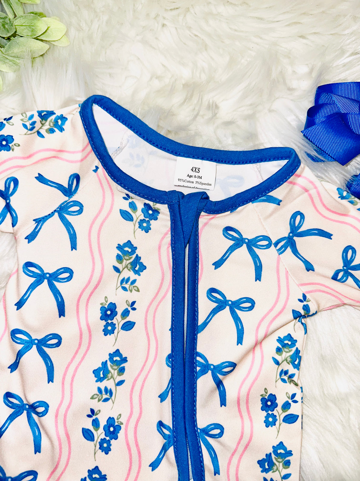 Girl’s pink and blue bow and floral sleeper