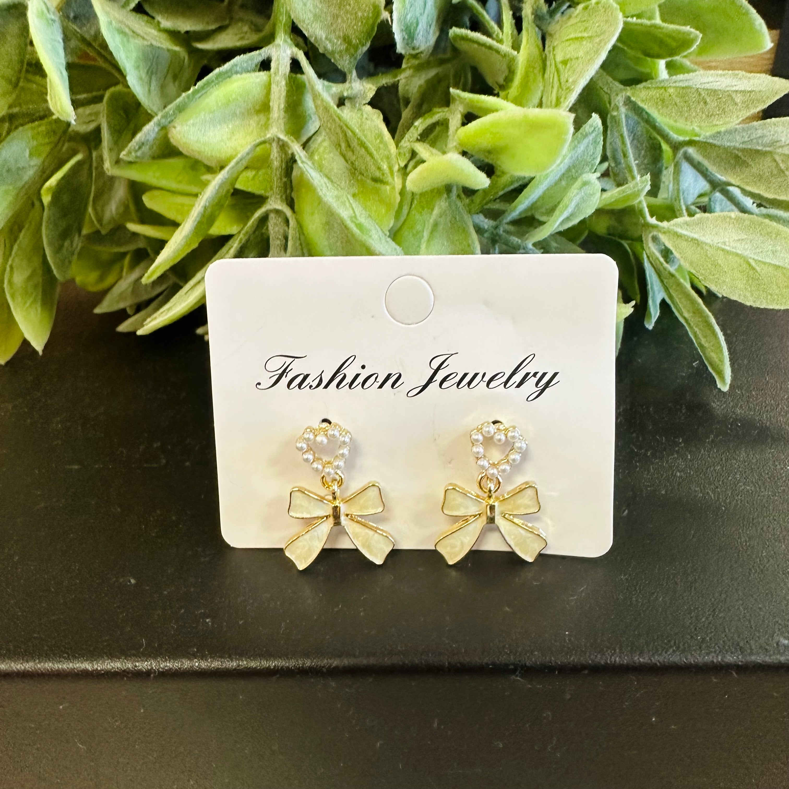 Women’s gold pearl heart with bow earrings