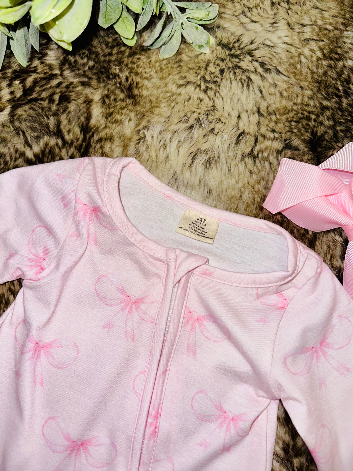 Girl’s light pink bow sleeper
