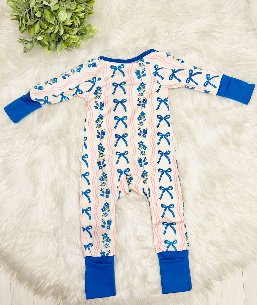 Girl’s pink and blue bow and floral sleeper