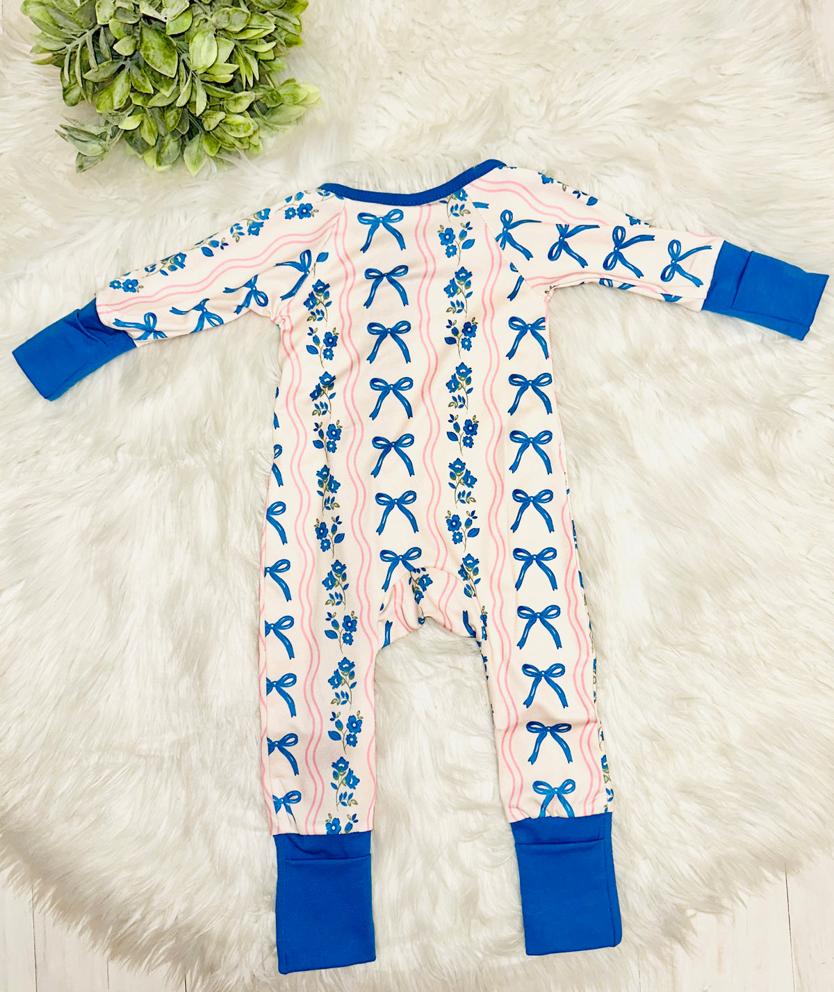 Girl’s pink and blue bow and floral sleeper