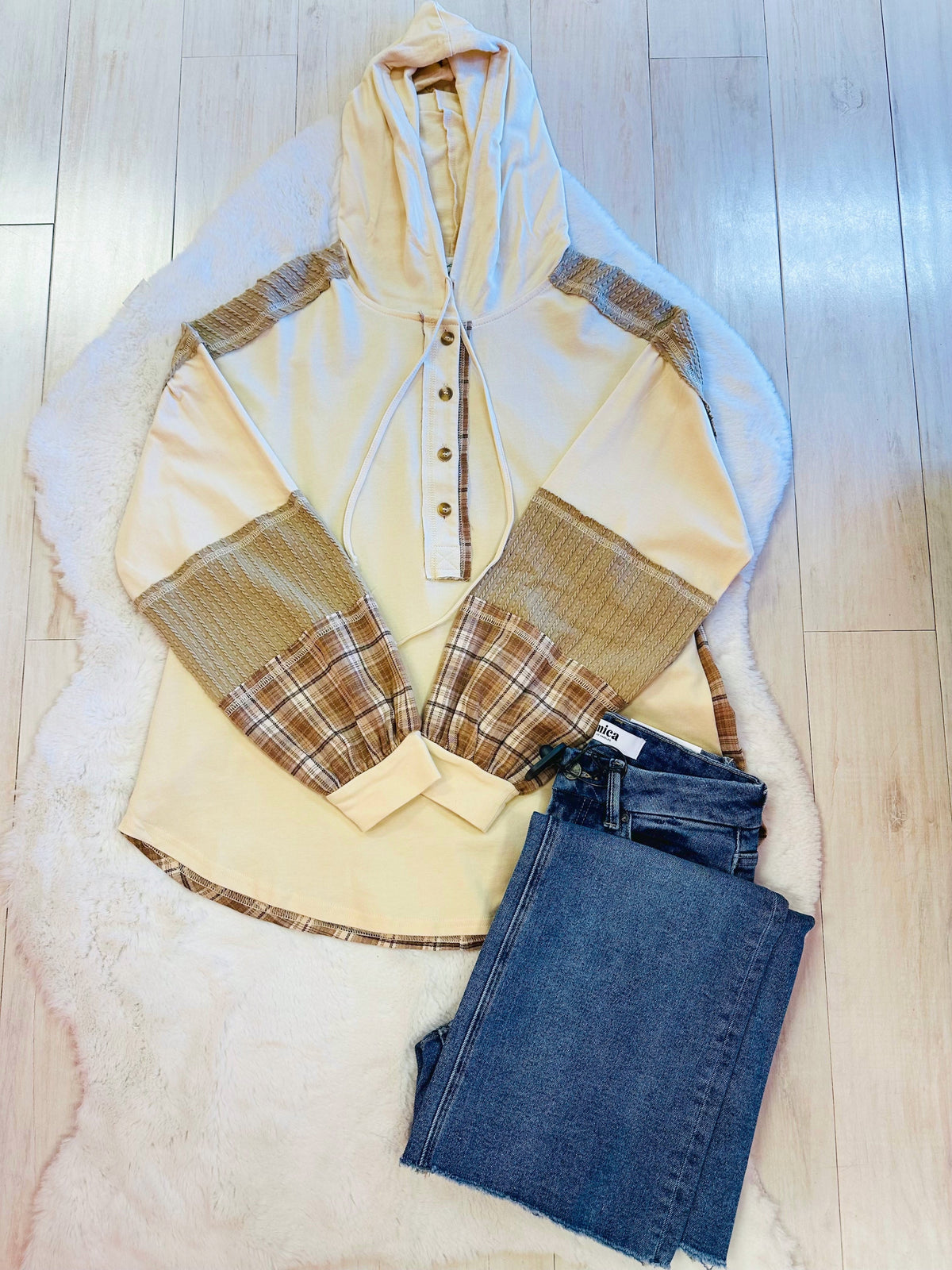 Women’s cream hooded top with plaid sleeves