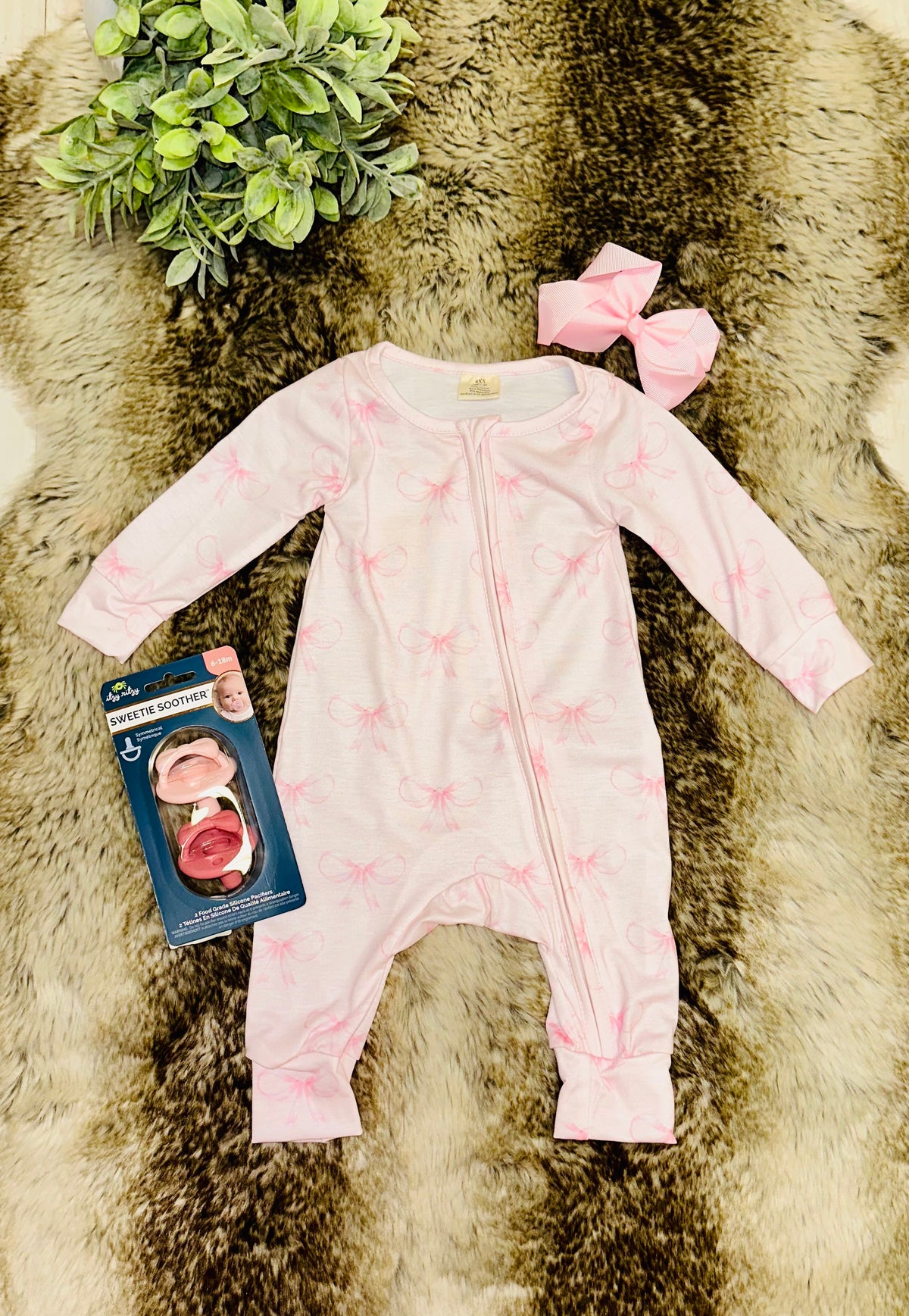 Girl’s light pink bow sleeper