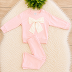 Girl’s Light Pink Outfit with Bow on Sweater