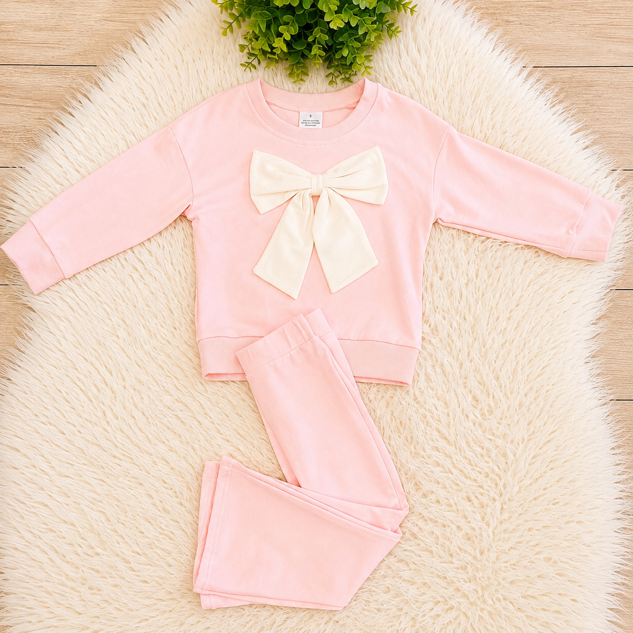 Girl’s Light Pink Outfit with Bow on Sweater