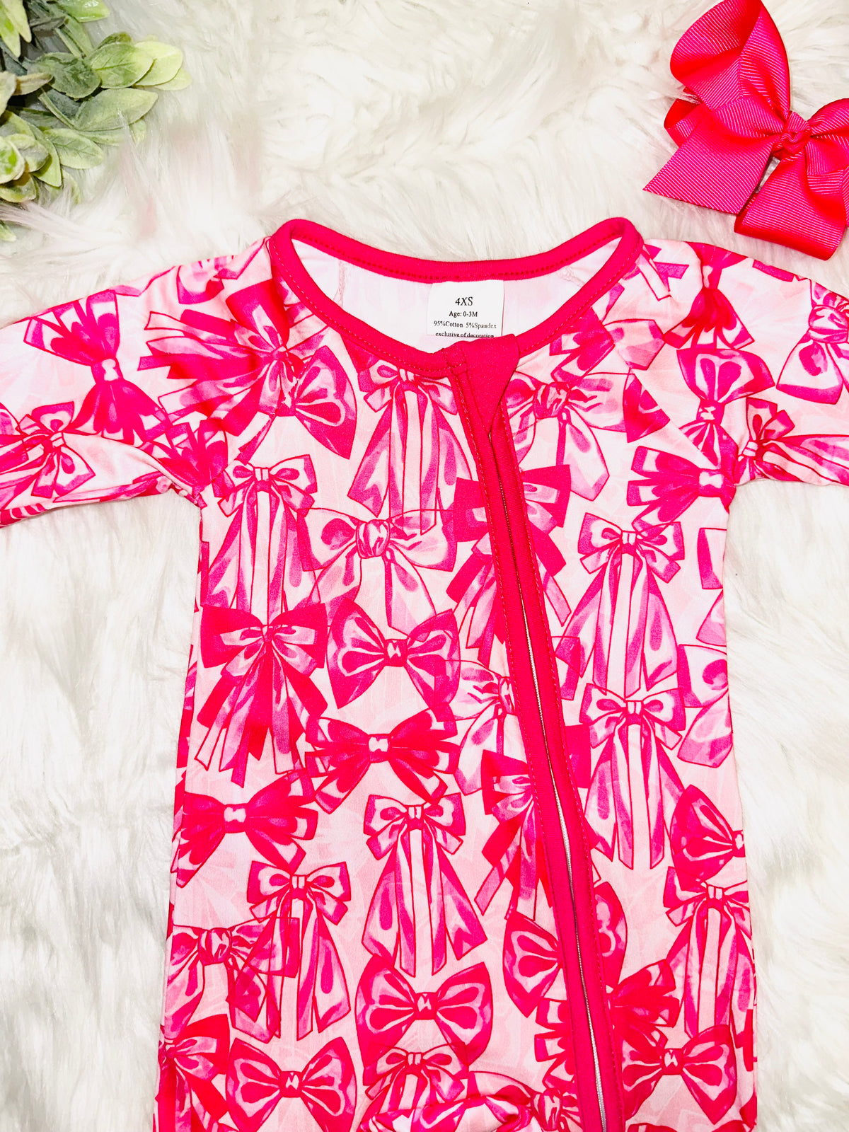 Girl’s dark pink bow sleeper