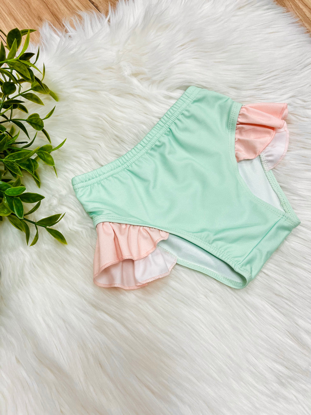 Girl’s Green Bathing Suit Bottoms with Peachy Pink Ruffle Trim