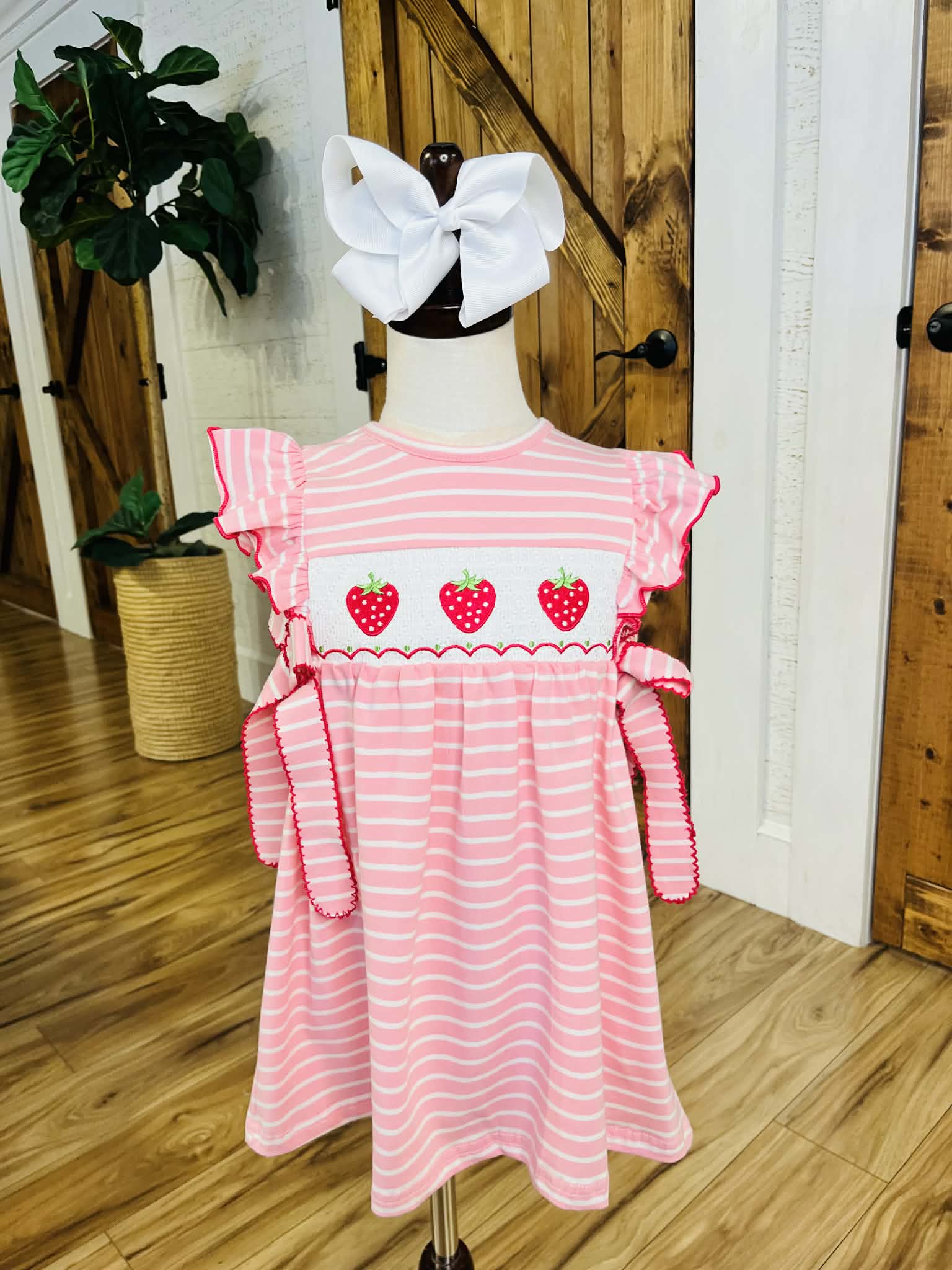 Girl’s strawberry embroidered pink stripe dress