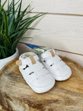 White leather baby shoes boys