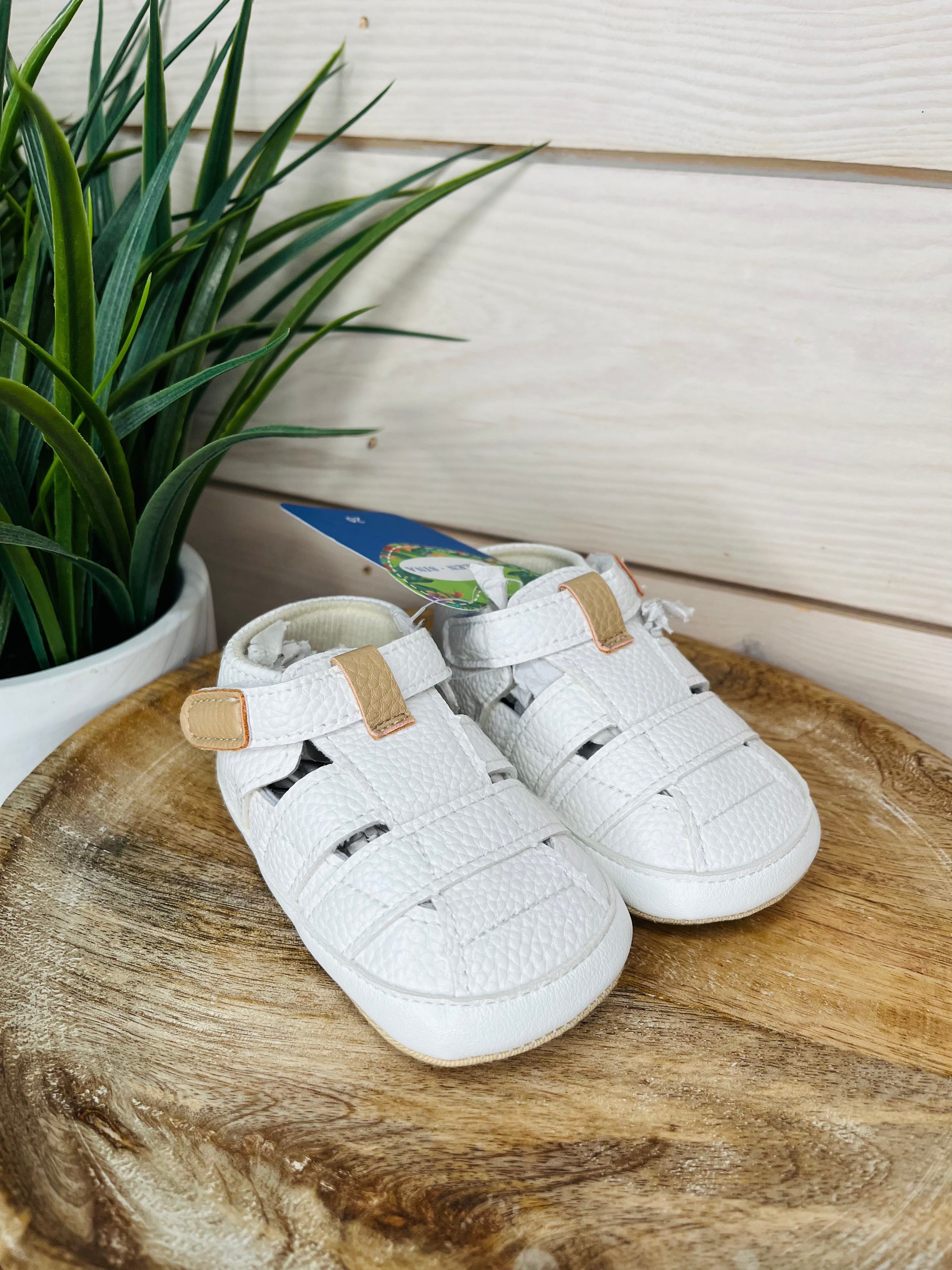 White leather baby shoes boys